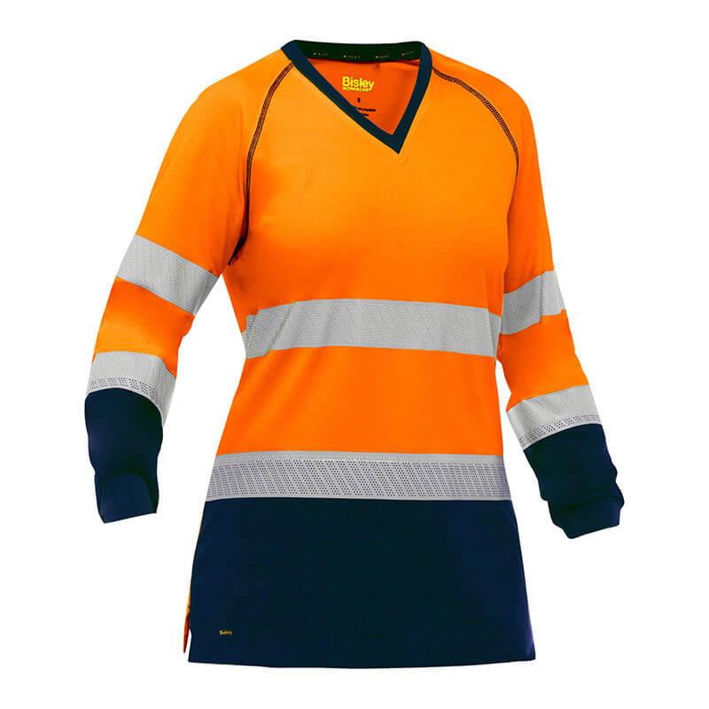 The PIP Bisley Women's Long Sleeve Shirt w/Navy Bottom, by Protective Industrial Products, is an orange safety shirt with antimicrobial treatment and reflective tape placed strategically across the chest, arms, and lower torso. Designed for high visibility, it features a V-neck with dark blue cuffs and hem to enhance both safety and style.