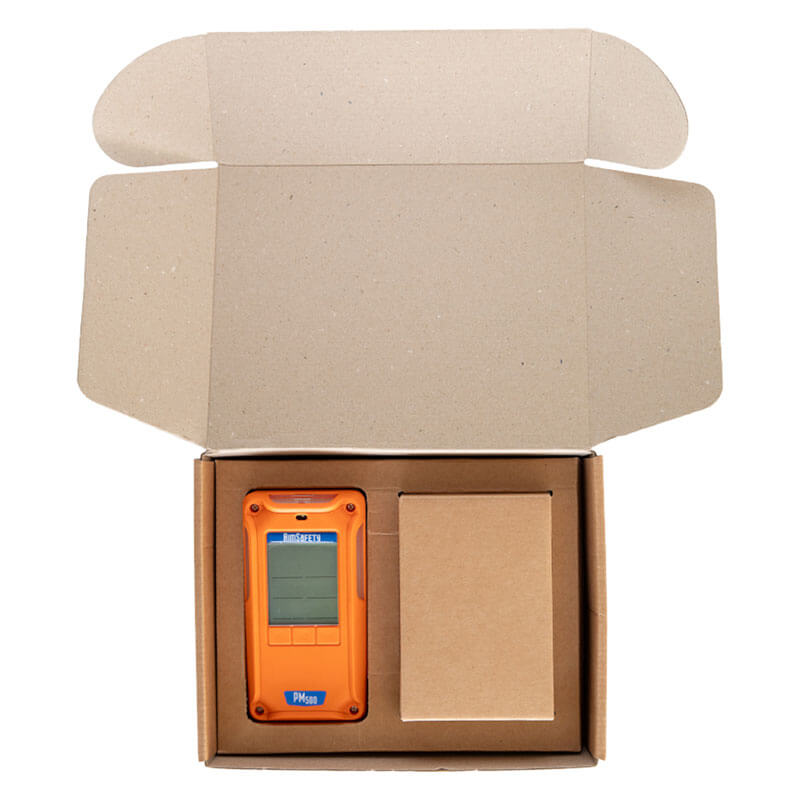 An open box contains the AimSafety Infrared LEL Multi-Gas w/Pump Monitor PM500-IR—an orange handheld detector with display and buttons—plus a smaller box, all in fitted compartments; ideal by AimSafety for hazardous or confined spaces.