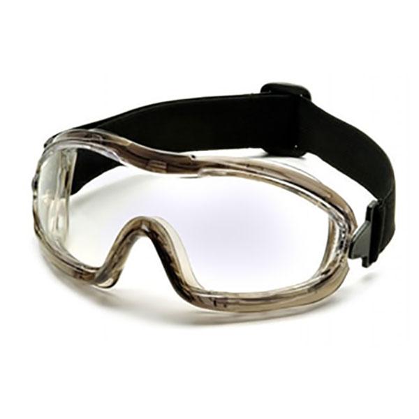 The Pyramex Low-Profile Chemical Splash Goggle by Pyramex Safety features a modern sport design with a black adjustable strap, a clear plastic lens, and a durable frame. It is ANSI Z87.1-2003 compliant, providing reliable protection for low-profile chemical splash goggle needs.