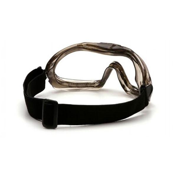 The Pyramex Safety Low-Profile Chemical Splash Goggle boasts a sleek sport design in black, with clear wraparound lenses and an adjustable strap for comfort. It meets ANSI Z87.1-2003 safety standards.