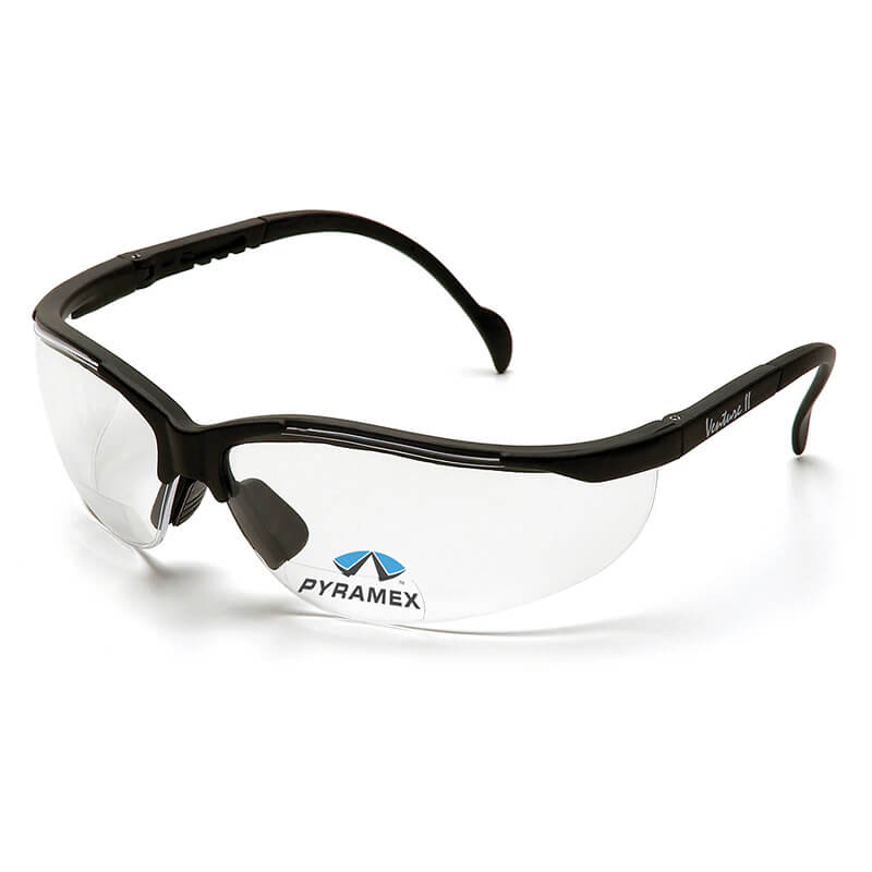 The Pyramex Venture II V2 Reader Safety Glasses, featuring clear bifocal lenses with black frames and the "Pyramex" logo on the left lens, offer adjustable nose pads and curved ear pieces for enhanced eye protection. These glasses from Pyramex Safety adhere to OSHA ANSI Z87.1 standards, ensuring superior safety assurance.
