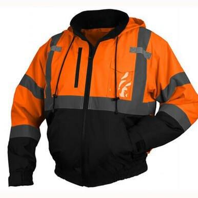 The Pyramex Safety RJ31 Hi-Vis Bomber Jacket features a vibrant orange and black design with gray reflective strips, a hood, front zipper, drawstrings, and a waterproof polyester shell for high visibility and protection in all conditions.