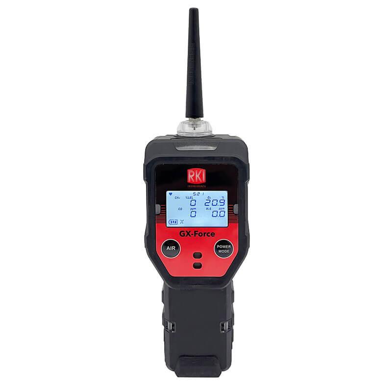 The RKI Instruments GX-Force Sample Draw 4 Gas Monitor 72-FA-A-A10 is a handheld device with a black and red exterior, ideal for leak investigations in confined spaces. It features a display screen for measurements, two buttons labeled "AIR" and "POWER MODE," and an antenna extending from the top.