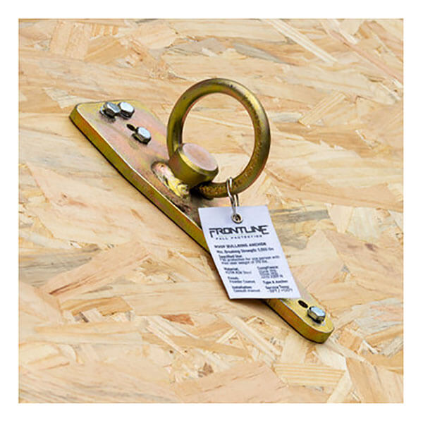 The Frontline Bull Ring Reusable Roof Anchor ROB01 by Frontline Fall Protection is a zinc-plated steel anchor with a large circular ring, bolted to wood. A "Frontline" tag on the ring displays product and fall arrest details.