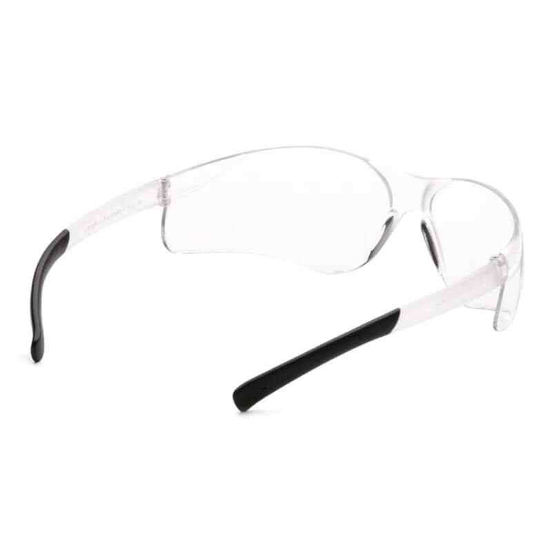 Pyramex Ztek Safety Glasses S2510S by Pyramex Safety feature clear lenses and black-tipped arms for comfort and protection. The transparent design ensures visibility and complies with ANSI Z87.1 standards. Sold 12 per box.