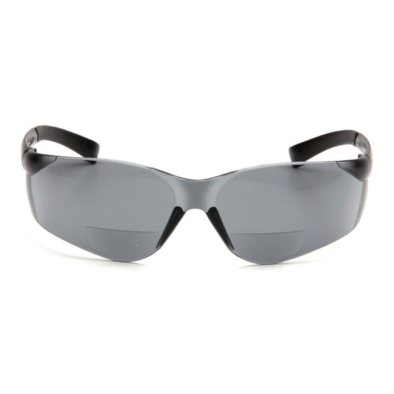 The Pyramex Safety Ztek Reader Safety Glasses S25_0R feature scratch-resistant, dark, slightly curved lenses with black frames and UV protection, shown from the front against a white background. Comes 6 per box.