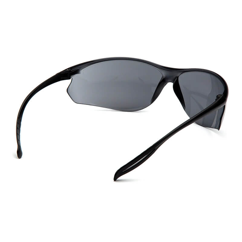 The Pyramex Neshoba H2Max Anti-Fog Safety Glasses by Pyramex Safety are shown from a rear side angle against a white background, featuring polycarbonate lenses with dark tint and UVA/UVB protection.