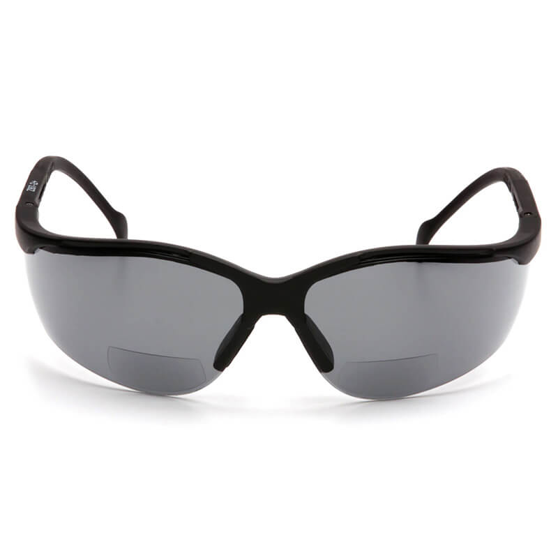 A pair of Pyramex Venture II V2 Reader Safety Glasses by Pyramex Safety, featuring black wraparound frames and dark tinted magnified lenses, is shown from the front against a white background.