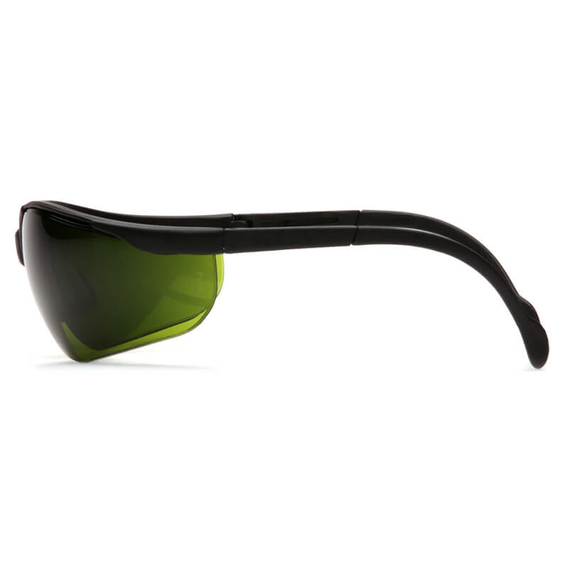 Side view of Pyramex Venture II Welding Safety Glasses SB18_0SF by Pyramex Safety, featuring curved dark green IR filter lenses for UV protection and thick black plastic arms, shown against a white background. Box of 12.