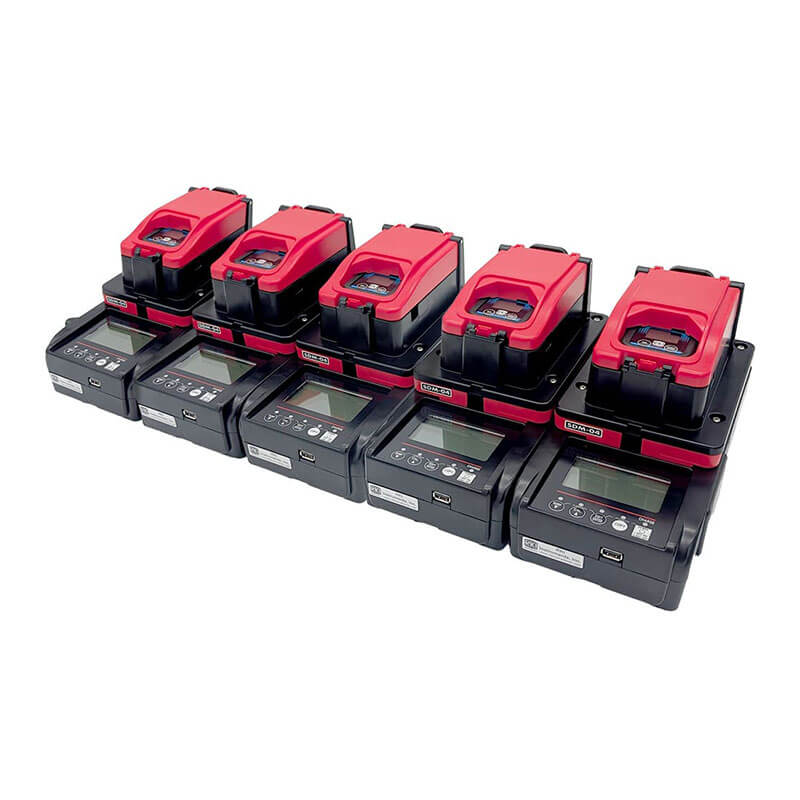 Six red and black RKI Instruments SDM-04 Calibration Stations (Toxics) 81-SDM04SC-10_ are lined up in two rows, each with digital displays and labeled buttons for portable gas monitor calibration and bump testing.