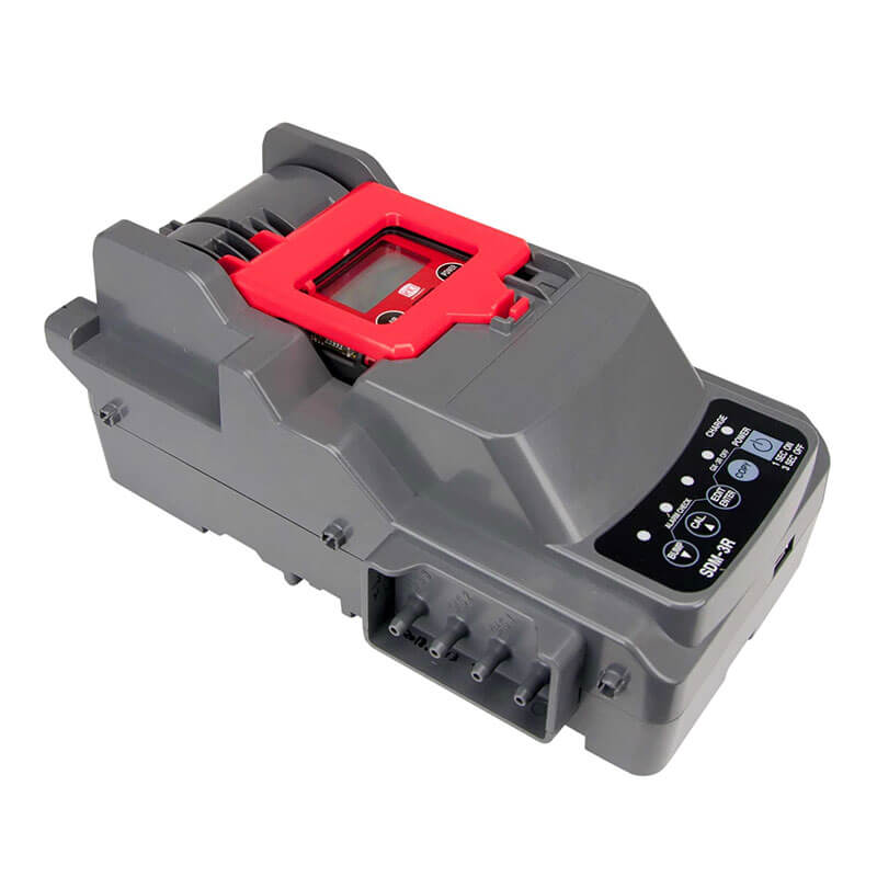The RKI Instruments SDM-3R Stand Alone Calibration Station (81-SDM3R101) is a gray unit with a red handle and side control panel, featuring buttons and indicator lights like those on gas monitor docking stations for bump test automation.