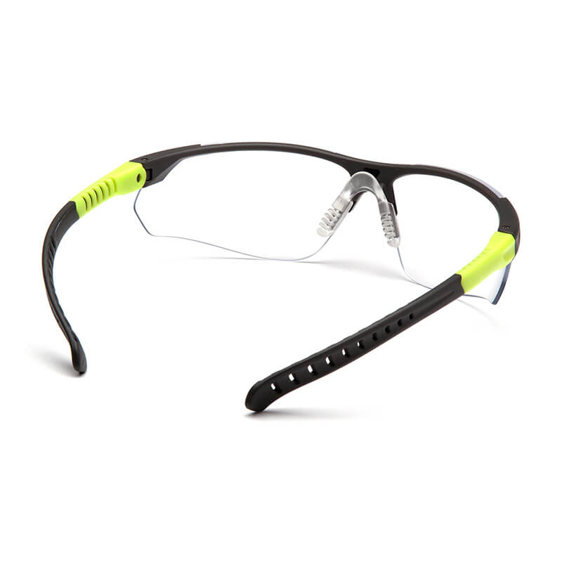 Pyramex Safety Sitecore Safety Glasses SGL101_0DTM feature clear lenses, a black frame with neon yellow-accented arms, ventilation holes, non-slip grips, adjustable temples, and adjustable nose pads for comfort. Sold 12 per box.