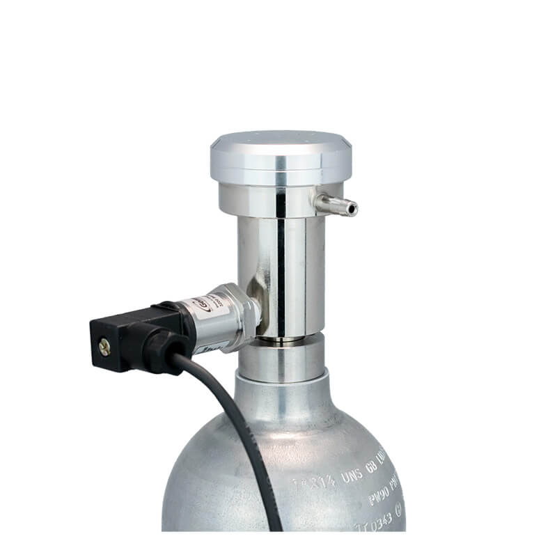 A close-up of the WatchGas Demand Flow Regulator with Pressure Sensor Valve, featuring a metal gas cylinder equipped with a small nozzle valve, an attached black electrical connector, and calibration gas regulator by WatchGas, set against a plain white background.