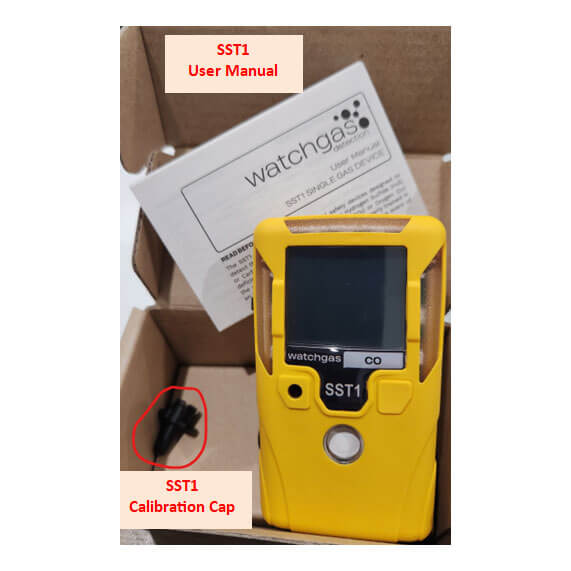 A WatchGas SST1 Serviceable CH4S Gas Detector SST1-MM in yellow with a digital screen is shown in its box, with a user manual behind it and a black calibration cap (circled in red) to the left. Uses solid polymer sensor technology.