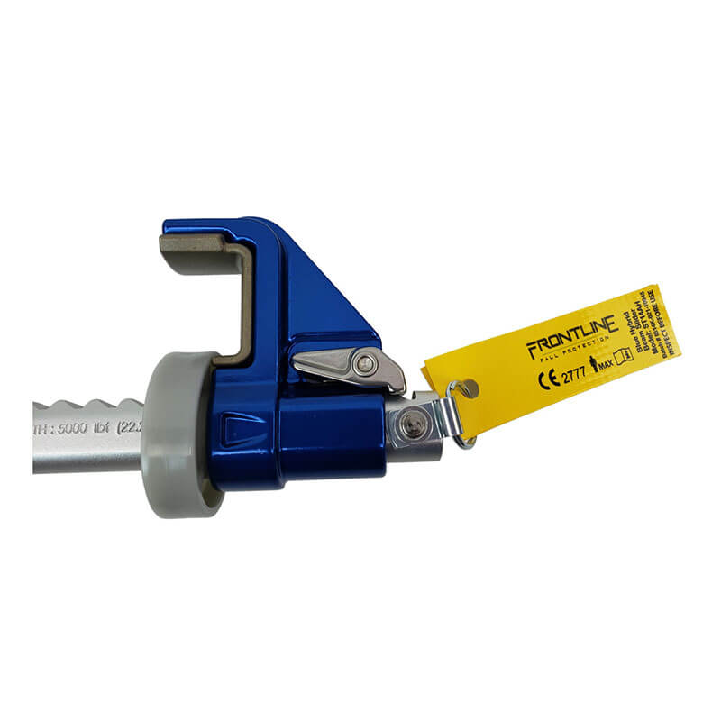 A blue Frontline Bantam Beamer Anchor for 3.5"-14" I-beams by Frontline Fall Protection, with a gray roller and a yellow inspection tag marked "FRONTLINE," is attached to a metal beam.