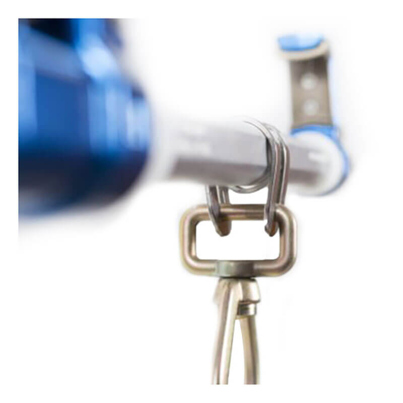 Close-up of a Frontline Bantam Beamer Anchor by Frontline Fall Protection attached to a metal bar (3.5"-14" wide I-beam), highlighting its aluminum connection. A blurred blue object appears in the background.