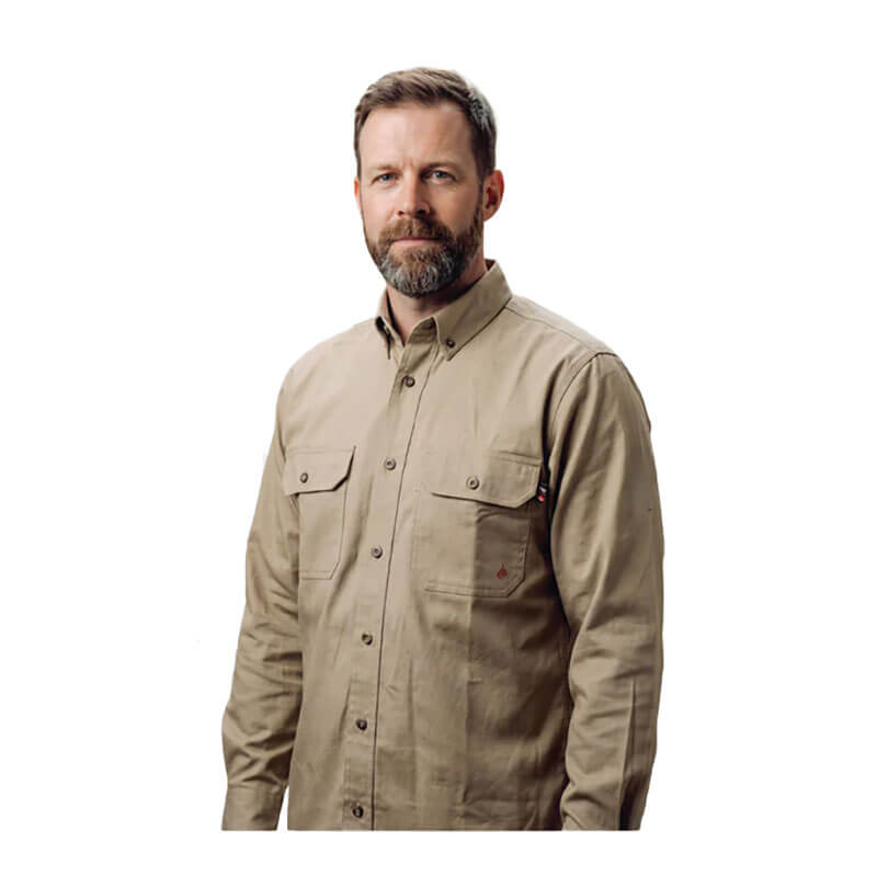 A bearded man stands facing forward against a white background, wearing a tan ForgeFR Forge FR Solid Button Shirt MFRLB2PS024 with chest pockets.