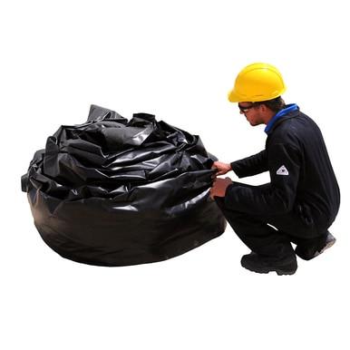 A worker in a yellow hard hat and black uniform crouches next to a large, coiled UltraTech Foam Wall Model Containment Berm, used for spill containment, set against a white background.