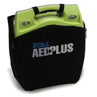 A ZOLL AED Plus Defibrillator Package 8000-0040_ _-01 by ZOLL is shown in a black carrying case, with “ZOLL AED PLUS” visible on the front and the green and yellow device above the zippered cover, highlighting Real CPR Help features.