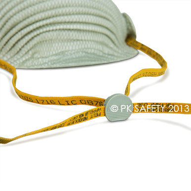 Close-up of a Moldex N95 Disposable Waved Respirator 4600, gray with a yellow adjustable strap and plastic clasp, photographed on a white background. "© PK SAFETY 2013" appears on the image. Sold in boxes of 10 by Moldex.