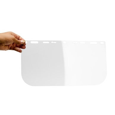 A hand holds the Pyramex Safety S1010 Clear Face Shield Visor Replacement, a rectangular shield with rounded corners and top slots—ideal as essential safety equipment.