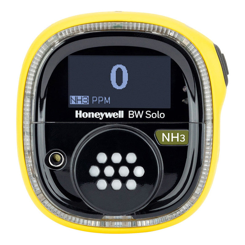 The BW Technologies by Honeywell BW Solo Wireless Gas Detector NH3 BWS1-A-Y displays "0 NH3 PPM" on its digital screen, showing ammonia levels. This yellow, compact, circular device features front ventilation holes and integrates with the Honeywell Safety Suite.