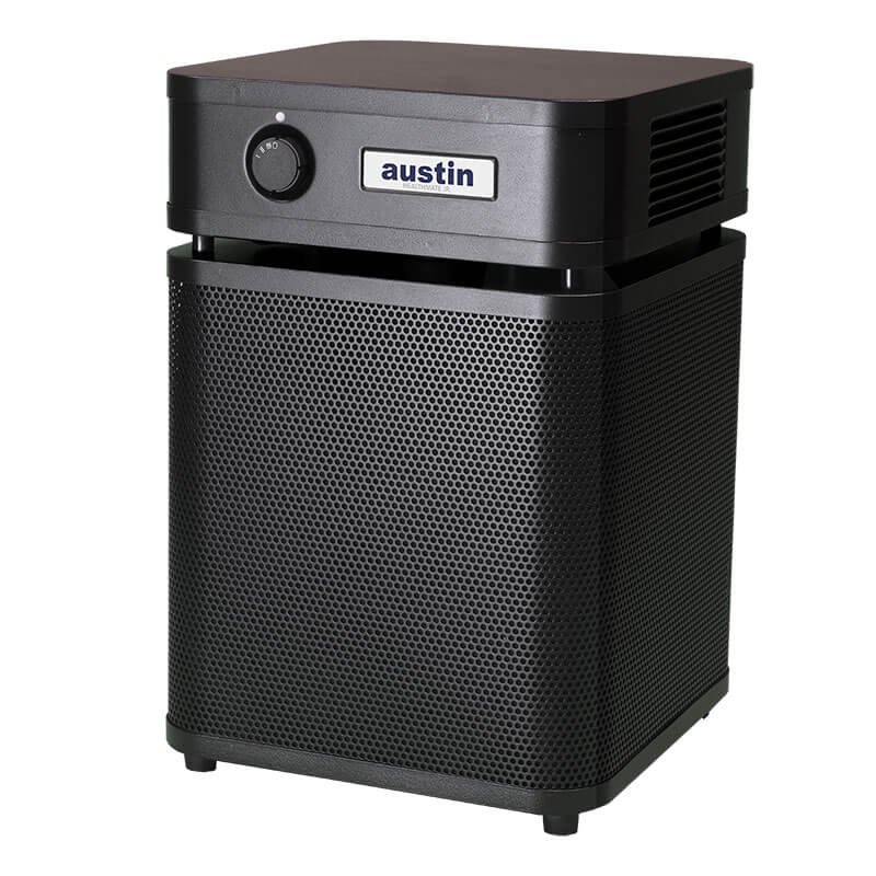 A black, box-shaped Austin Air Systems HealthMate Junior Machine A200 HEPA purifier with vented body, single control knob, "austin" logo on front, and four feet. Perfect for allergy relief.