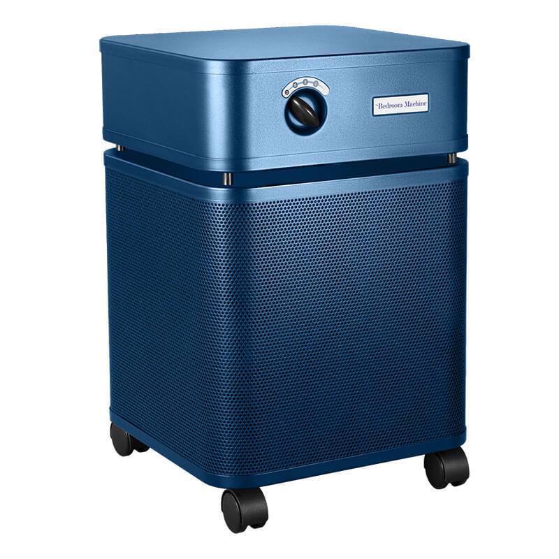 The Austin Air Systems Bedroom Machine B402 is a blue, box-shaped air purifier with front control knob, perforated sides, four black caster wheels, and a medical-grade HEPA filter for superior air purification.