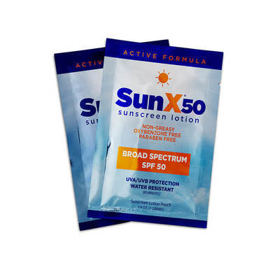 Two blue and white Coretex Sun X 50 Sunscreen sachets (SPF 50, with dry towelette, Broad Spectrum, Non-Greasy, Water Resistant, Oxybenzone Free), labeled in orange and white text with a sun graphic at the top.