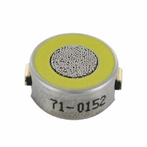 A compact circular electronic component, frequently utilized as a replacement gas sensor, featuring a metallic exterior and a yellow top with a textured gray center. The side bears the label "71-0152." This LEL sensor component from RKI Instruments, model NC-6264A, includes two metal contacts for connectivity.