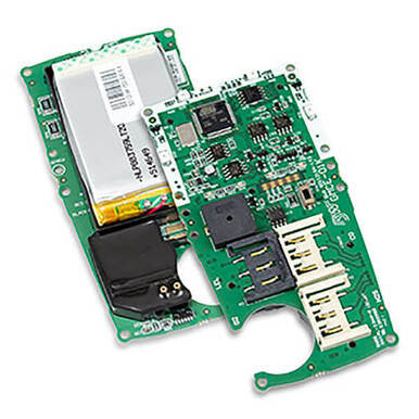 Close-up of a green circuit board from the BW Honeywell Replacement PCB kit for GasAlertMicroClip XL by PK Safety Supply, featuring various electronic components, including slots for SIM cards or memory, visible chips, connectors, and a replacement battery kit attached on the side.