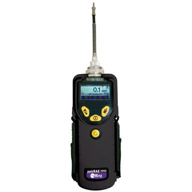 A handheld black electronic device with a digital display reading "0.1" features three yellow buttons and an antenna-like sensor at the top, functioning as a photoionization detector. The VOC monitor is branded as the RAE Systems ppbRAE 3000.