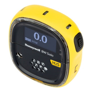 The BW Honeywell BW Solo Wireless Gas Detector H2S BWS1-HL-Y in yellow shows "0.0 PPM" on its digital screen. This compact hydrogen sulfide detector is equipped with a black front panel and vents, specifically designed for effective gas detection.