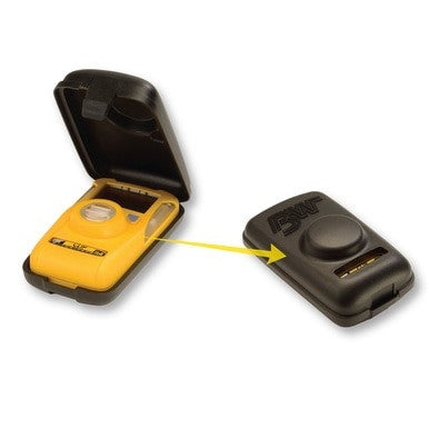 An open yellow handheld device, which seems to be a BW Clip gas monitor, features a digital display and buttons showing its internal components. Beside it sits a closed black PK Safety Supply BW Clip Hibernation Case (Model: CLIPHB-CASE), marked by a central raised section, highlighted by an arrow.
