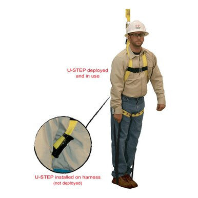 An individual is equipped with a full body harness and the French Creek U-STEP Suspension Trauma Straps (Pair) from PK Safety Supply. The image zooms in on this setup to show the U-STEP in both its deployed and non-deployed states. To ensure comprehensive fall protection, the person also wears a hard hat, goggles, work shirt, jeans, and boots.
