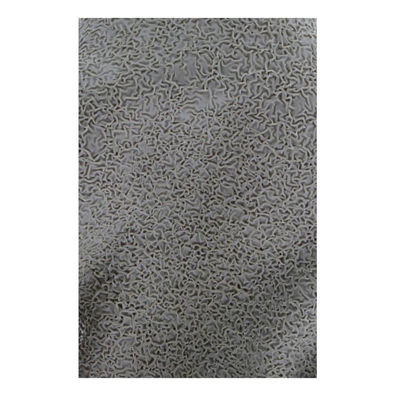 A close-up of the gray, textured surface with an intricate, maze-like pattern—much like the durable grip on MCR Safety Memphis Flex-Therm Glove 9690 (12 pairs)—creates an organic and abstract design.