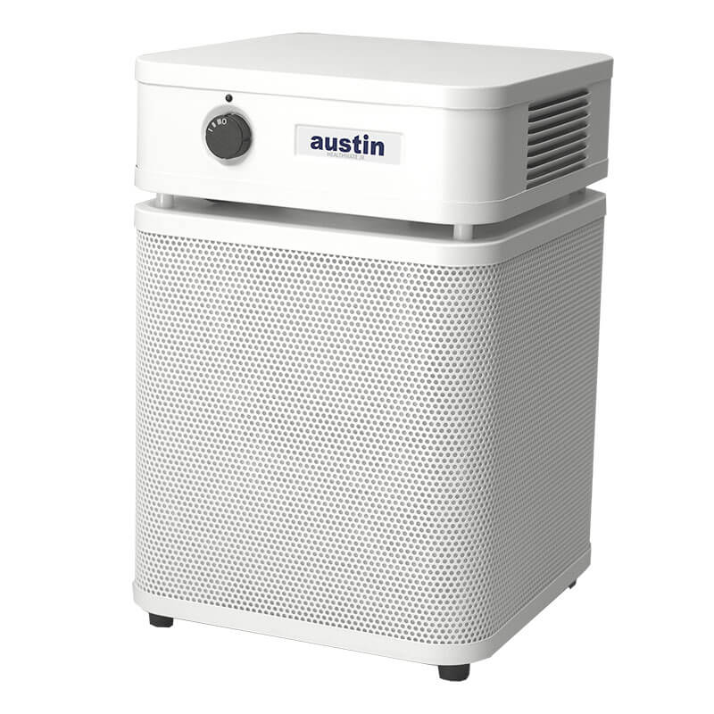 The Austin Air Systems HealthMate Junior Machine A200, a white HEPA air purifier with a square design, front air vent, knob control, and rounded edges on four feet, is ideal for reducing allergies.