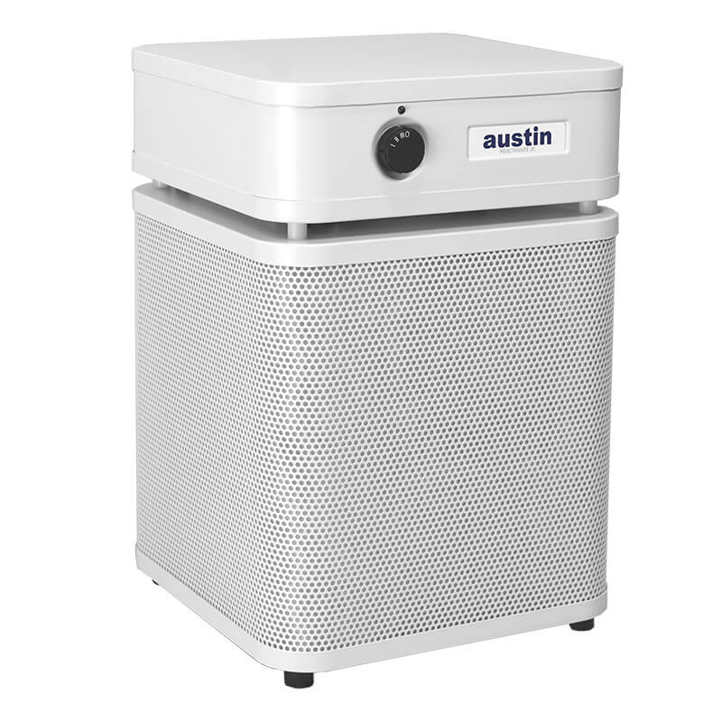 The Austin Air Systems HealthMate Junior Machine A200 is a white, box-shaped HEPA air purifier with a perforated metal body, front control knob, “austin” label, and black feet—ideal for allergy relief.