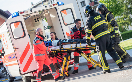 First responders tending to an injured person.