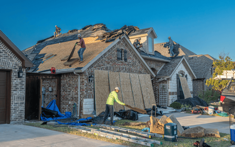 Roofers working on a residential home.