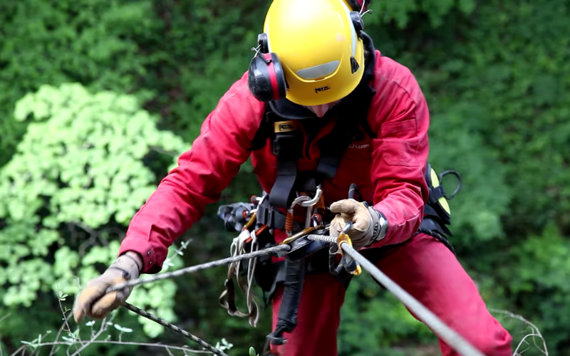 Worker using self braking descender.