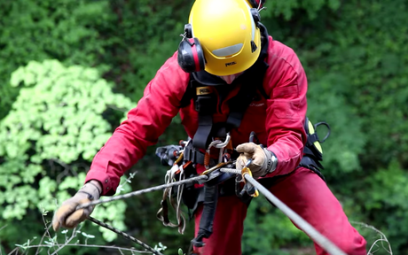 Worker using self braking descender.