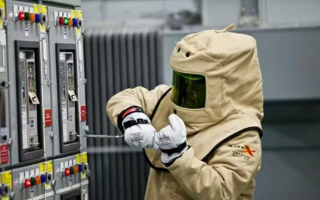 Worker wearing arc flash PPE.