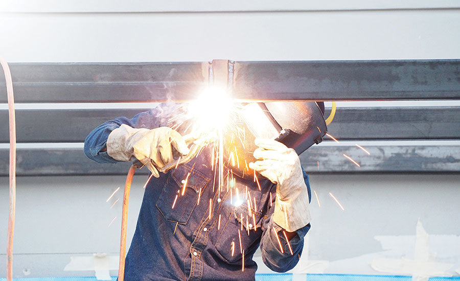 Welder wearing arc rated (AR) clothing.