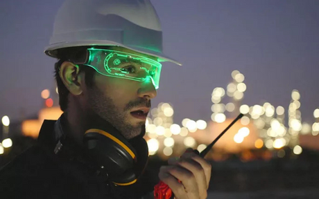 Worker wearing safety glasses that glow with lights.