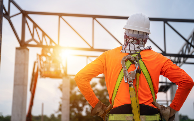 A worker looks towards a potentially sharp edge.