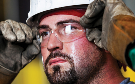 Worker wearing safety glasses.