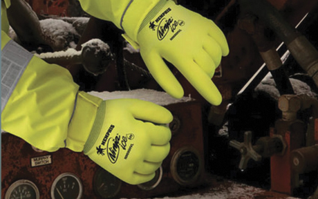 Worker wears hi-vis safety gloves during winter.