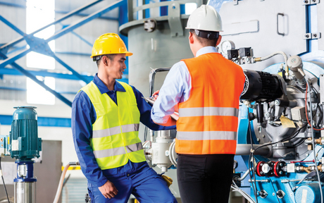 Manager speaks with worker at a facility.