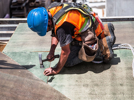 Construction worker wearing hard hat.